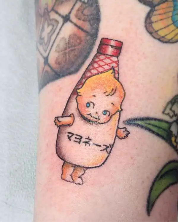 A color tattoo of a Kewpie doll in a Japanese mayonnaise bottle, by Amanda Boyd
