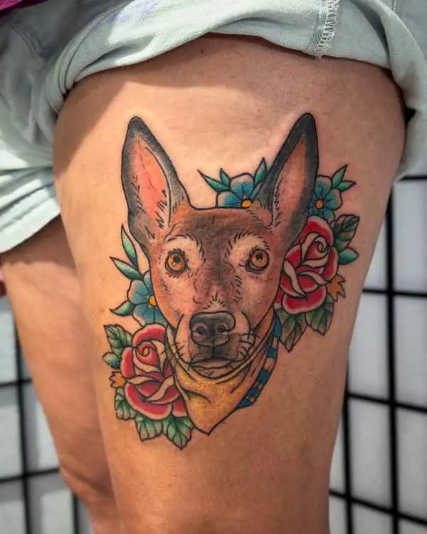 A color portrait of a big-eared brown dog in a yellow bandana framed by red roses, on a thigh, by Shannon Moxie