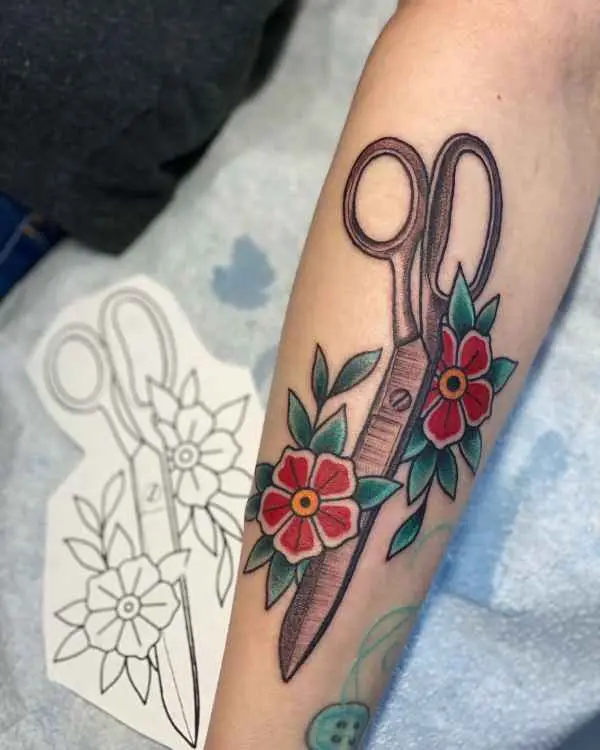 A shears tattoo with red flowers, by Betty Rose